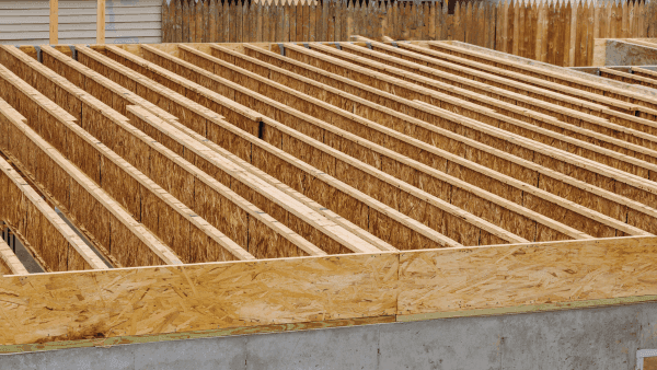 A pattern of wood floor joist in new construction by valentynsemenov from Canva